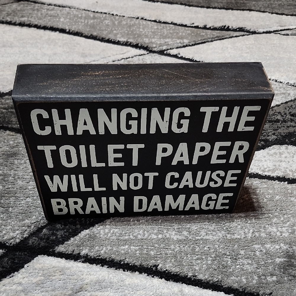 "CHANGING THE TOILET PAPER WILL NOT CAUSE BRAIN DAMAGE" WOODEN SIGN